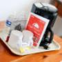 coffee maker and supplies in room