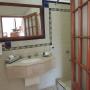 Vanity area and bathroom