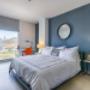 Bedroom with large windows.