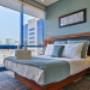 Bedroom with floor to ceiling windows