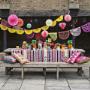 Mexican fiesta decorations by ArtMexico. Vibrant fun table party decorations with papel picado bunting and other colourful decor.