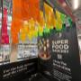 Papel picado flags expo decorations with the brand logo cut into the flags